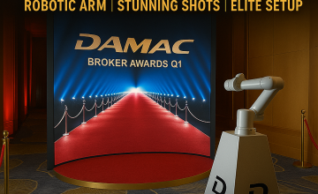 Guest posing in front of a Glambot slow motion video booth at a luxury event in Dubai, captured in cinematic style with a robotic camera arm.